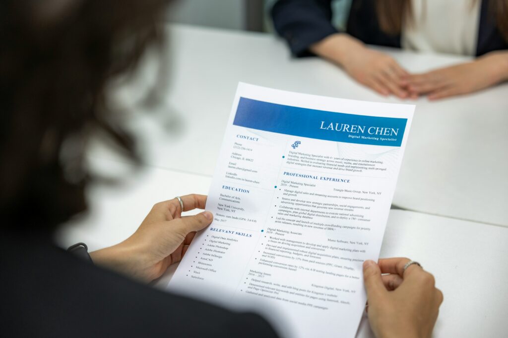 A woman holding a resume