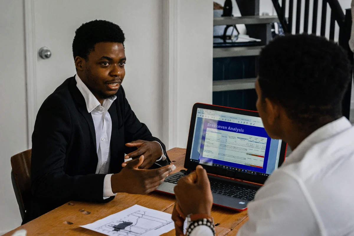Young businessman presenting financial insights during a meeting.